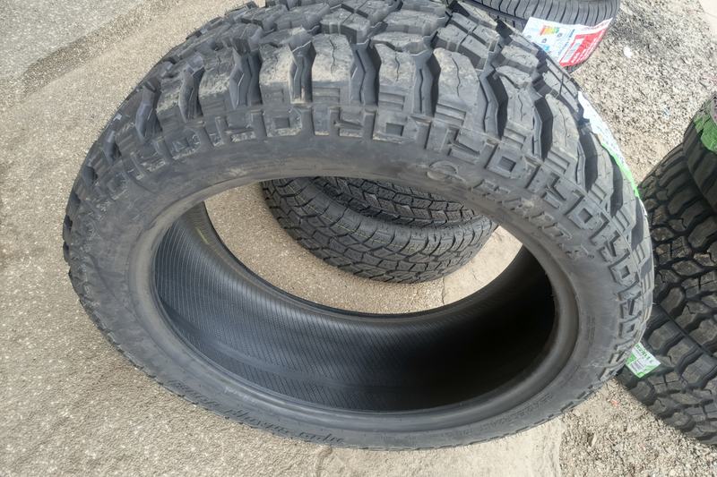 Inside of a new off-road tyre showing the inner liner, with the tread above