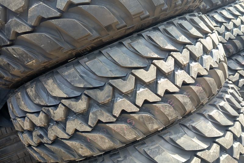 Stack of new mud-terrain tyres with a chunky tread pattern