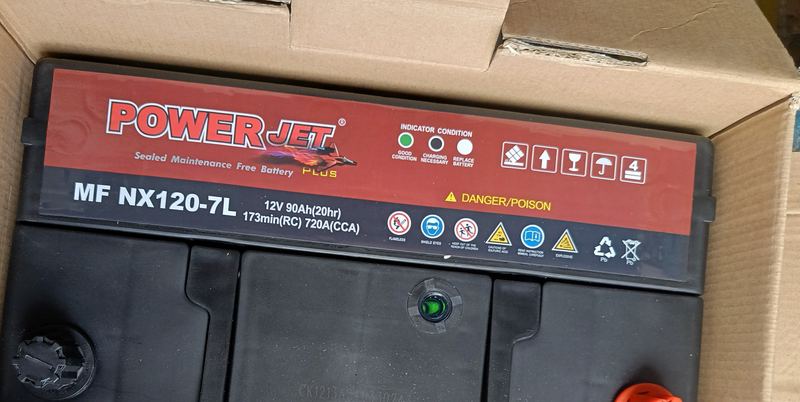 Car battery label showing 12V, 90Ah, reserve capacity and cold-cranking amps ratings
