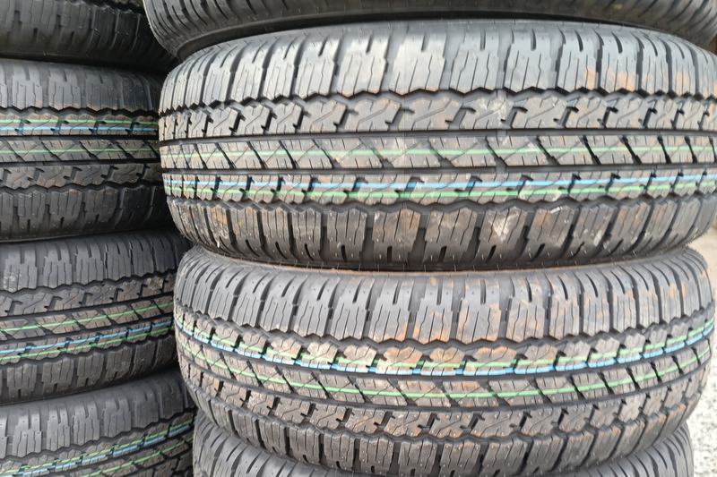 Stack of new tyres outside a tyre shop