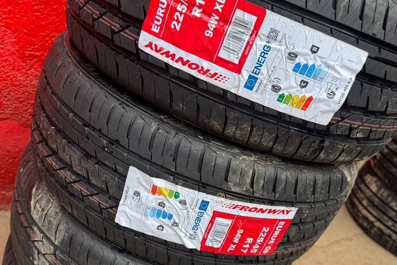 Stack of new Fronway tyres outside a tyre shop